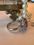 Ring. Oval Pink Tourmaline and Diamond Cluster Ring.