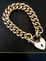 Bracelet - curb link 9ct gold. Heart padlock.